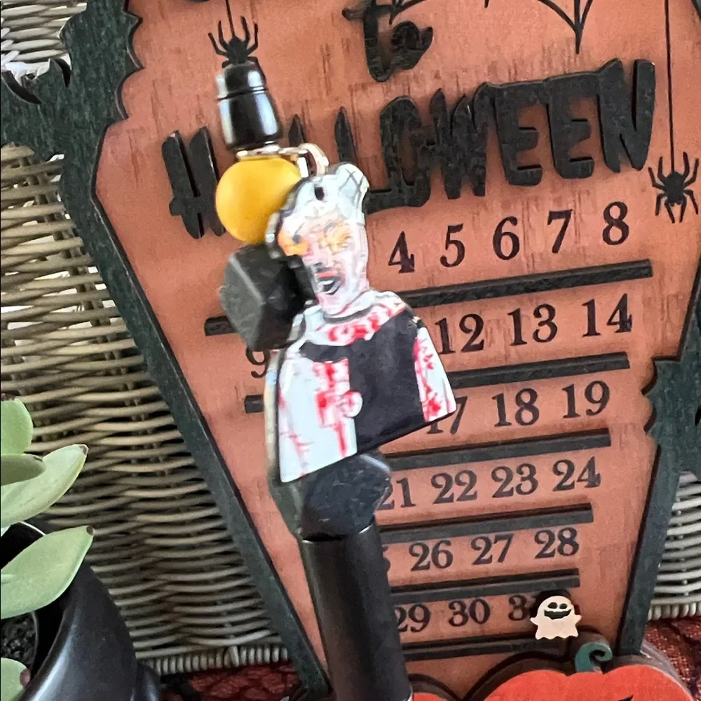 Black and Yellow Beaded Pen with Art the clown Charm
